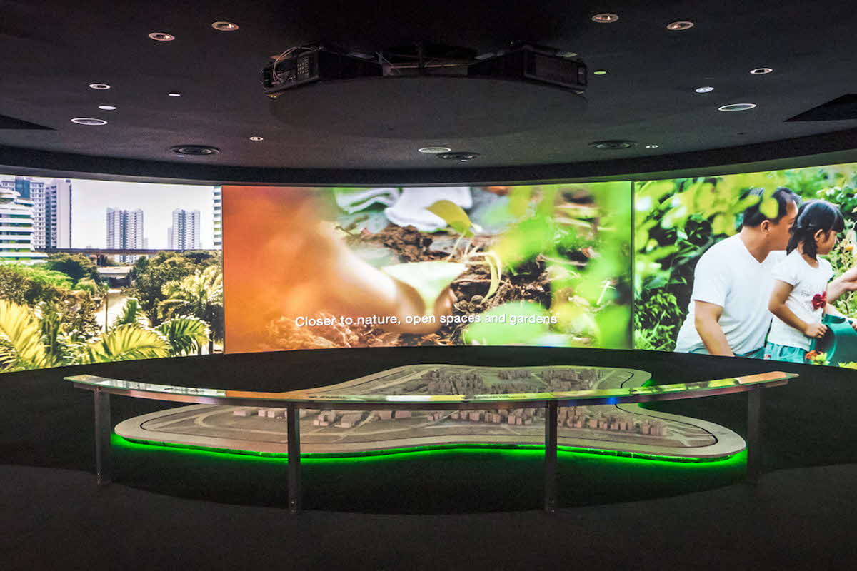 Digital screens showing multimedia shows in HDB LIVINGSPACE Gallery.