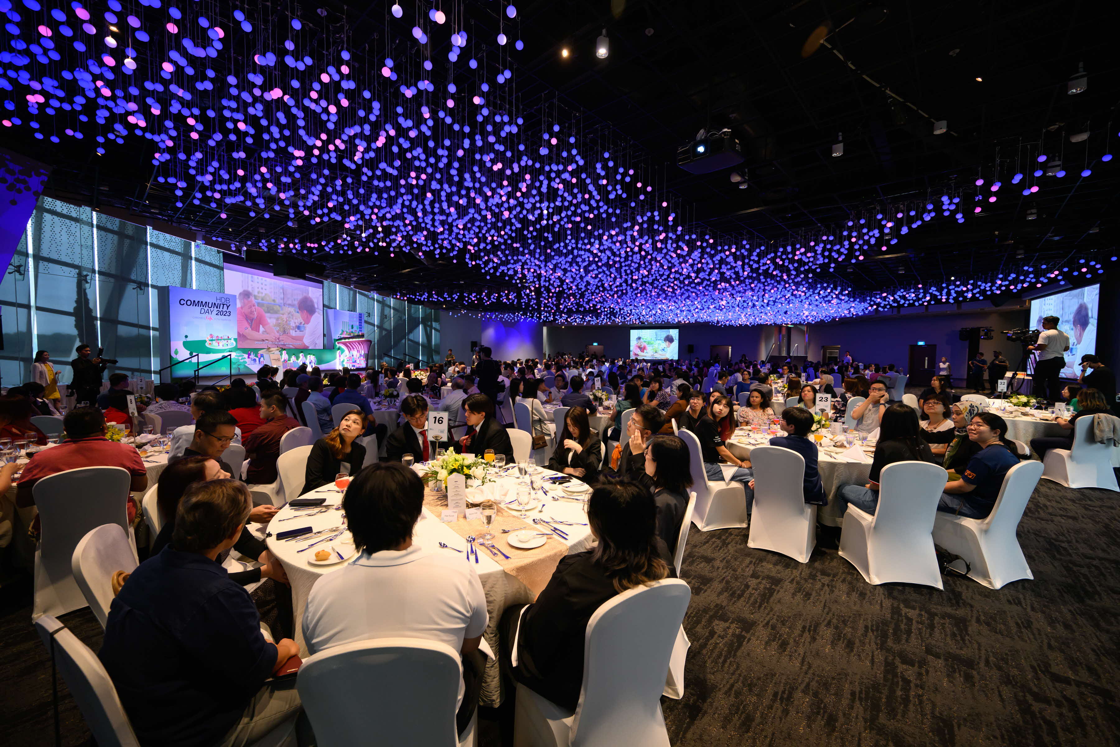 Award recipients viewing the opening video for HDB Community Day 2023