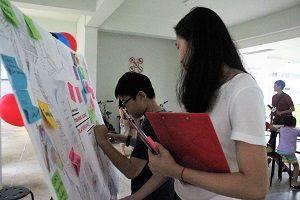 Volunteers engaging residents on the theme of the playground at pop up roadshows