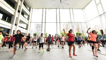 Group exercises at the community plaza